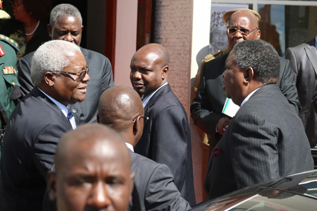 Vice Phelekezela Mphoko is welcomed by Home Affairs Minister Ignatius Chombo at Stodart Hall in Mbare