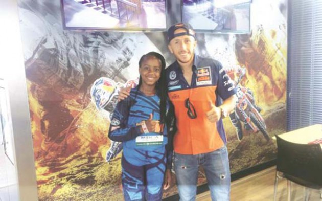 IN GOOD COMPANY . . . Top Zimbabwean female motocross rider Tanya Muzinda (left) meets world champion Tony Cairoli before the weekend’s Grand Prix at Lommel, Belgium, where she was “the guest of honour” of the Italian biker