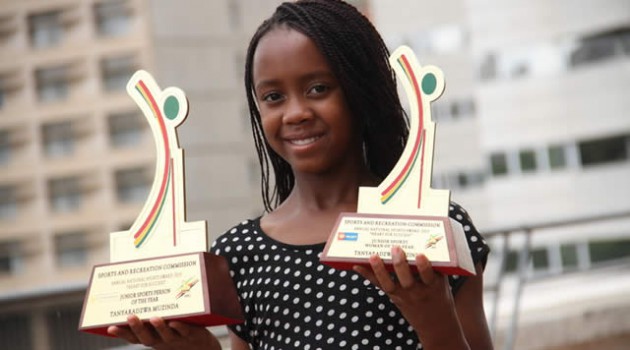 JUST MAKE MINE A DOUBLE . . . Top young female motocross rider Tanya Muzinda proudly displays the Zimbabwe Junior Sportsperson of the Year and Junior Sportswoman of the Year awards trophies that she won at Wednesday’s night’s ANSA banquet in Harare
