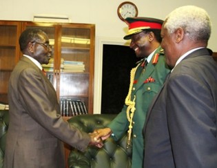 President Mugabe welcomes Tanzanian People’s Defence Forces Chief General Davis Adolf Mwamunyange while Defence Minister Sydney Sekeramayi looks on in Harare yesterday.