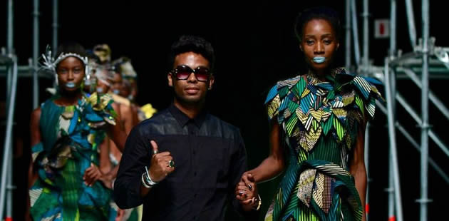 Designer David Tlale with models on the ramp
