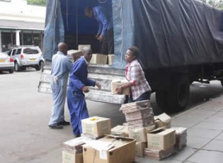 Zimpapers staffers load goodies  donated to Tokwe Mukosi flood victims at Chingwizi resettlement on Saturday.