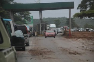Long queues have become the order of the day since the computerisation of some tollgates. In this picture, motorists wait their turn to pay at a tollgate along Harare-Mutoko road near the Shamva turn off yesterday  