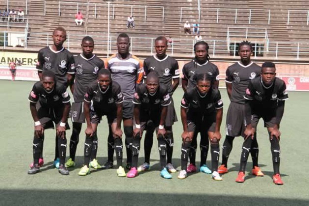 GIANT-KILLERS . . . Tsholotsho FC players line up for their pre-match photo shoot at Rufaro yesterday, about 90 minutes before producing a shock result that was felt across the entire domestic Premiership, as they beat Harare City in the first game of the 2015 Castle Lager Premiership season