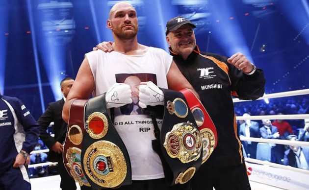 CHAMP WITH PROPHETIC NAME . . . Briton Tyson Fury (left) holds his four new world heavyweight boxing championship belts after beating Wladimir Klitschko in Dusseldorf on Saturday night. — Mailonline