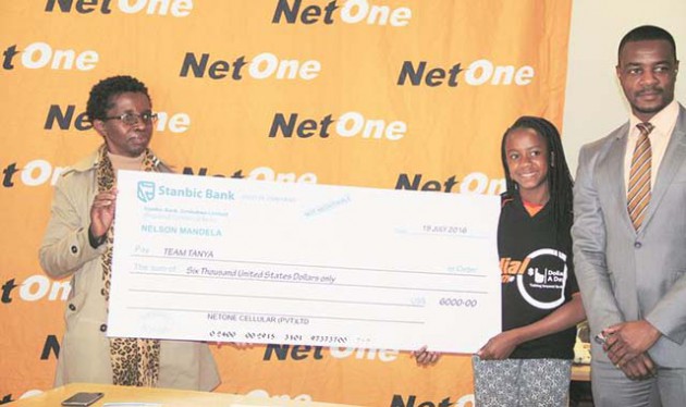 THE WORLD IN ONE . . . Ace Zimbabwean female motocross rider Tanya Muzinda (centre) receives her $6 000 sponsorship from NetOne’s head operations officer (Harare Zone), Patricia Magejo (left), and the company’s executive research and development officer, Spencer Manguwa, during yesterday’s function in Harare ahead of her European tour later this month