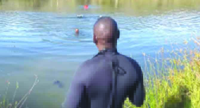 The ZRP Sub-Aqua Unit searches for the two men’s bodies at Fern Valley Dam on Monday