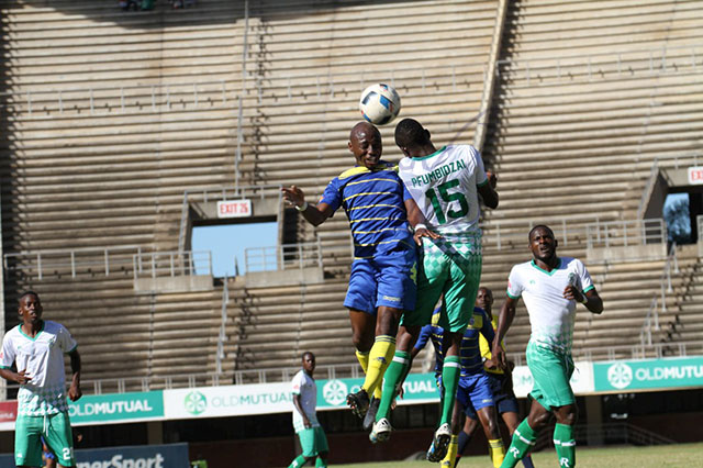 The ball is mine-Harare City forward Martin Vengesai and CAPS United defender Ronald Pfumbidzai tussle for an aerial ball