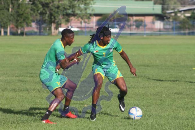 The ball is mine-warriors defender Costa Nhamoinesu shielding the ball from Evans Rusike
