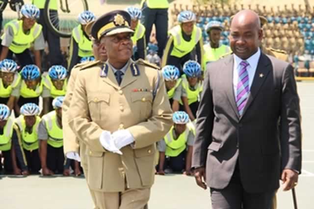 Attorney-General Mr Johanes Tomana (right) chats with Commissioner-General of Police Augustine Chihuri during a police pass-out parade in Harare yesterday