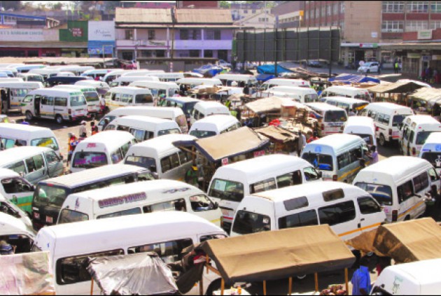 Kombis await their turn to ferry commuters to various suburbs at the Market Square rank