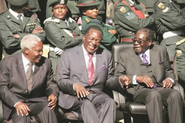 President Mugabe shares a lighter moment with Vice President Emmerson Mnangagwa (centre) and Defence Minister Dr Sydney Sekeramayi at a Zimbabwe National Army Military Academy pass out parade in Gweru yesterday. —  (Picture by John Manzongo)