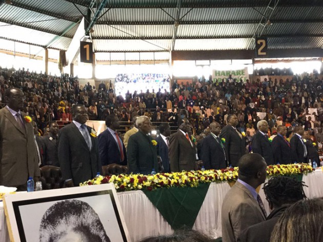 Delegates stand at attention as the National Anthem is being sung.