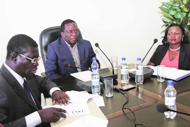 Vice President Emmerson Mnangagwa flanked by Secretary for Justice, Legal and Parliamentary Affairs Virginia Mabhiza( right) and Attorney-General Prince Machaya at a press briefing in Harare yesterday
