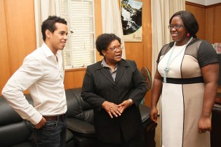 SHINING LIGHT . . . Vice President Joice Mujuru (centre) shares a light moment with motor racing driver Axcil Jefferies (left) and Sport, Arts and Culture Deputy Minister Tabetha Kanengoni-Malinga during yesterday’s meeting in Harare