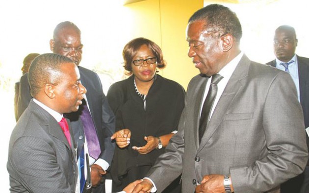 Vice President Emmerson Mnangagwa talks to Public Accountants and Auditors board chairperson Mr Brian Njikizana (left), while Minister of State in his office Clifford Sibanda and Minister of State for Harare Metropolitan Provincial Affairs Miriam Chikukwa look on during a conference in Harare yesterday. — (Picture by John Manzongo)