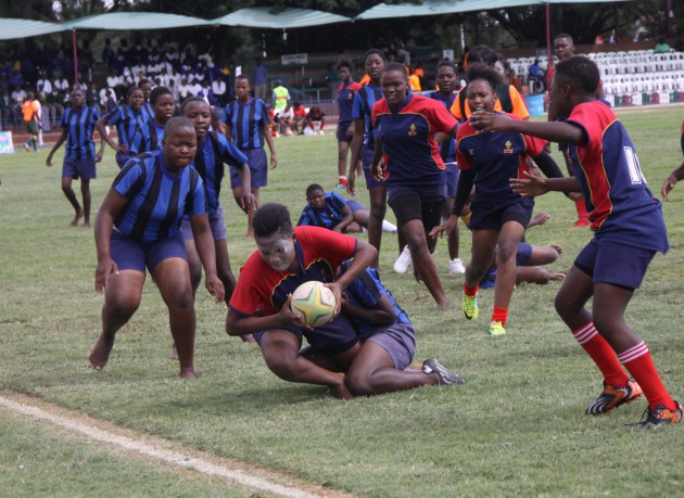  Vainona girls lock Rumbidza Meki (with ball) goes for a try as her side demolish George Stark girls in the opening morning of the Dairibord Schools Rugby Festival today 