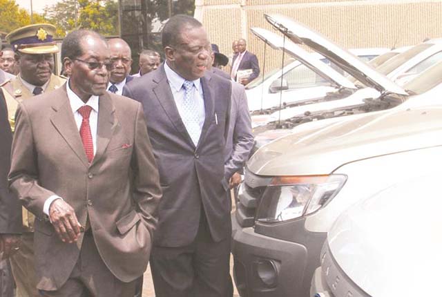 President Mugabe and Vice President Emmerson Mnangagwa view a fleet of vehicles for use by the Welfare for War Veterans, Ex-Detainees and Restrictees Ministry at zanu-pf Headquarters yesterday. — (Picture by John Manzongo)