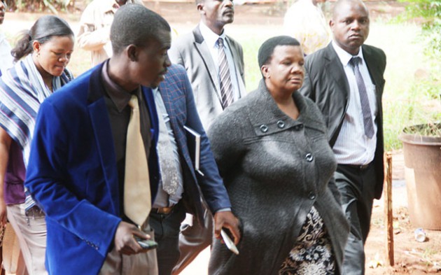 Mbare Police, Officer-in-charge of traffic, Chief Inspector Violet Sigauke being escorted by police detectives on arrival at the Harare Magistrates Courts yesterday on allegations of receiving a bribe. — Picture by Shelton Muchena