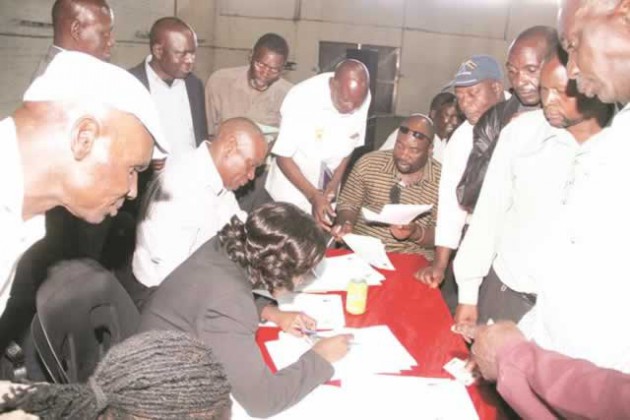 Comrades-in-Arms . . . War veterans get accredited in Harare yesterday ahead of their crucial meeting with President Mugabe in the capital today. - (Picture by Justin Mutenda)