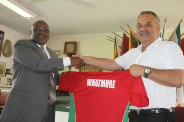 NEW BROOM . . . ZC board chairman Wilson Manase (left) hands over the national team jersey to new coach Dav Whatmore during yesterday’s unveiling ceremony at Harare Sports Club. — (Picture by Innocent Makawa)