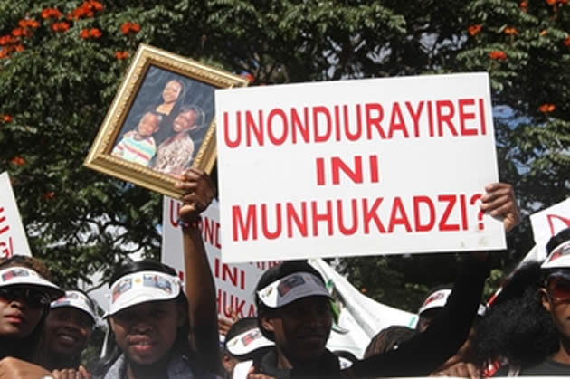 Students from the Women's University in Africa demonstrate against gender-based violence along Sam Nujoma Street in Harare yesterday in memory of a fellow student who was allegedly killed by her husband last month. -(Picture by Innocent Makawa)