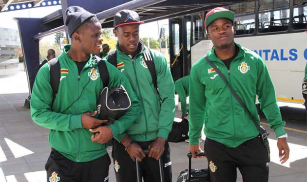 MEN OF THE MOMENT . . . Warriors players (from left) Donovan Bernard, Blessing Moyo and Tatenda Mukuruva chat at Harare International Airport before their departure for Namibia for the Cosafa tournament yesterday