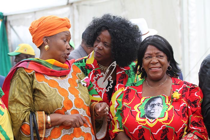 Cde Muchinguri-Kashiri (L) chats with fellow comrades Beatrice Nyamupinga (c) and Edna Madzongwe.