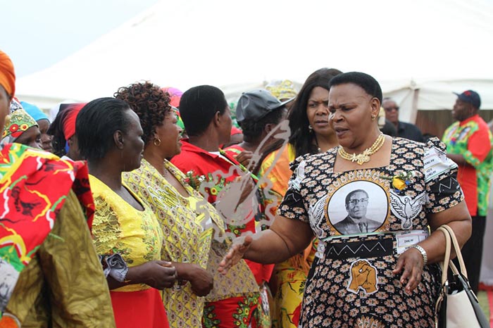 Zanu-PF Women's League Secretary for the Commissariat Cde Mabel Chinomona greets party supporters as she arrives for the Buhera North rally at St.Johns School.