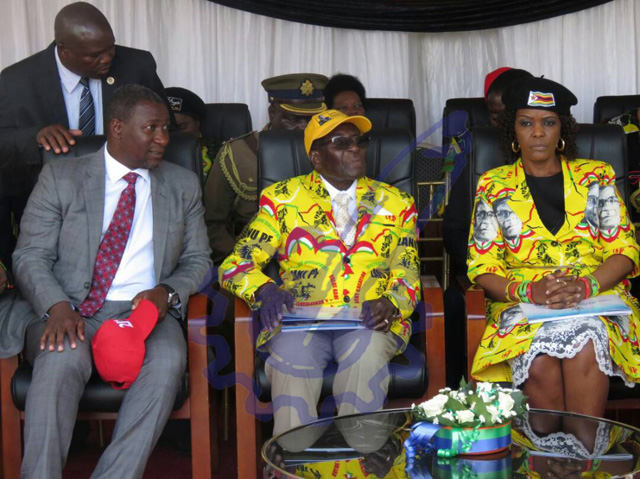 President Mugabe flanked by Minister Supa mandiwanzira (L) and First Lady Dr Amai Grace Mugabe before addressing thousands of Zanu-PF supporters at Sakubva Stadium Friday afternoon.