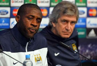 CALM BEFORE THE STORM . . . Manchester City midfielder Yaya Toure (left) and manager Manuel Pellegrini address the media at a Press conference at The Etihad Stadium in Manchester, north-west England, yesterday ahead of their Champions League last 16, first leg match against Barcelona. — AFP.