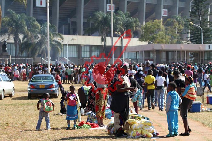 President Mugabe officially handing over a flag during a colour presentation to ZDF Formations while Commander ZDF General Constantino, Nyikadzino Chiwenga look on during the ZDF Day Celebrations at the National Sports Stadium in Harare. – Picture by John Manzongo