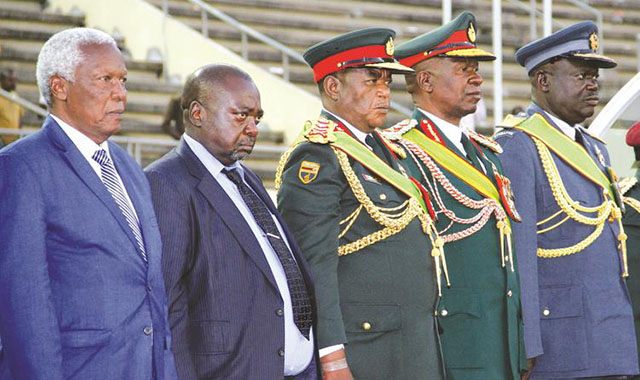 Defence Minister Sydney Sekeramayi, Permanent Secretary Martin Rushwaya, ZDF Commander General Constantino Chiwenga, Zimbabwe National Army Commander Lieutenant General Phillip Valerio Sibanda and Airforce of Zimbabwe Commander Air Marshal Perrance Shiri stand at attention during ZDF Day celebrations in Harare yesterday. — Picture by John Manzongo