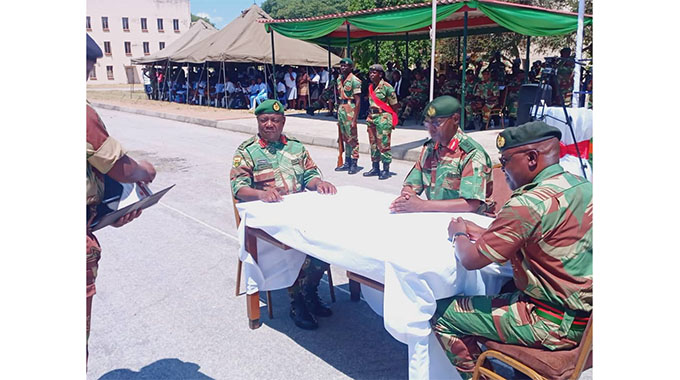 Members of the ZNA march at Rudhaka Stadium today