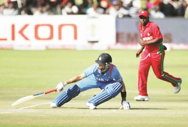 CAPTAIN FANTASTIC . . . India’s captain Virat Kohli (left) is seen in action during the 3rd match of the 5 cricket ODI series between Zimbabwe and India at Harare Sports Club yesterday. — AFP