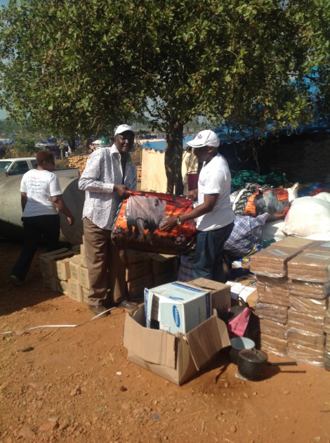Zimpapers Group Digital Editor Innocent Gore hands over some of the donated goods to Mwenezi District Administrator Mr Stanley Chamisa