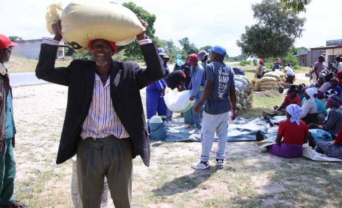 Mr Zondai Bhasera of Dema Village is all smiles after receiving his maize allocation for the month