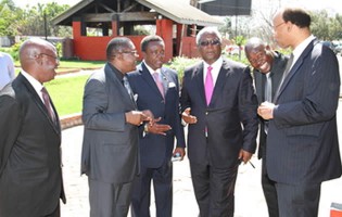 East 24 owner Mr Ernest Madziro (left), outgoing Government ministers Walter Mzembi, Webster Shamu, Ignatius Chombo, businessman Mr Farai Jere and investor and former US Congressman Mel Reynolds share a lighter moment at the launch of the Hilton Hotel construction plan in Harare yesterday.