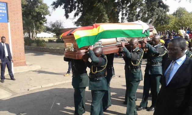 The casket is carried into Stodart hall. Pic by Lincoln Towindo