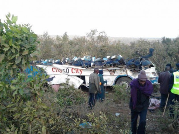 Locals and the police at scene of a bus accident in Narok where 41 people died and 33 others were injured on August 29, 2013.