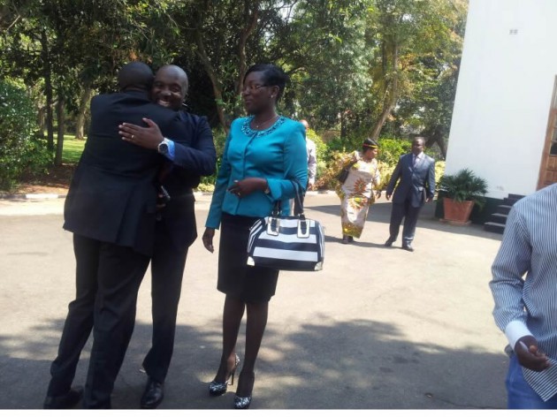 Deputy Minister of Health and Child Care being congratulated by Ace Lumumba.
