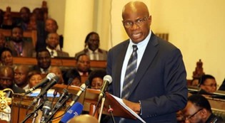 Finance Minister Patrick Chinamasa presents the 2014 National Budget in Parliament in Harare yesterday