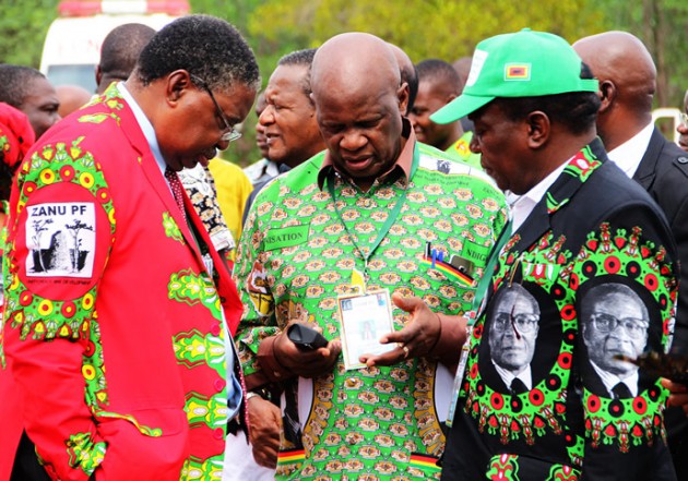VPs Mphoko and Mnangagwa talk to secretary for Legal Affairs Cde Patrick Chinamasa before the official opening yesterday.