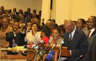 Some legislators celebrate after the presentation of the 2014 Budget by Finance and Economic Development Minister Patrick Chinamasa in Harare yesterday