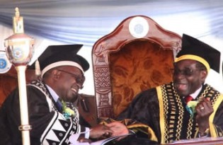 Chinhoyi University of Technology Chancellor President Mugabe shares a lighter moment with vice chancellor Professor David Simbi during the institution’s ninth graduation ceremony in Chinhoyi yesterday. — (Picture by Munyaradzi Chamalimba)