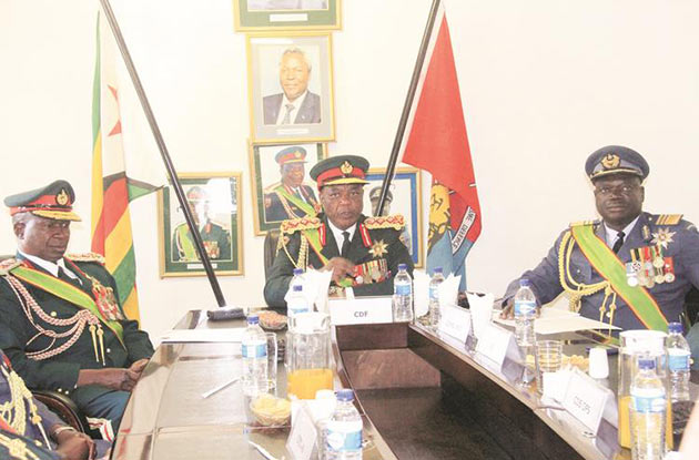 Commander of the Zimbabwe Defence Forces General Constantino Guveya Dominic Nyikadzino Chiwenga flanked by Zimbabwe National Army Commander Lieutenant-General Philip Valerio Sibanda (left) and Air Force Commander Air Marshal Perrance Shiri, addresses a Press conference to mark the 36th anniversary of the ZDF Day Commemorations in Harare yesterday. — (Picture by Munyaradzi Chamalimba)