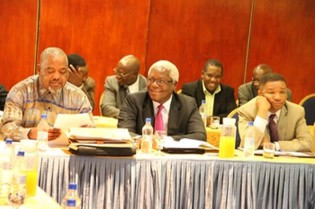 Local Goverment, Public Works and National Housing Minister Dr Ignatius Chombo flanked by his deputy Minister Joel Matiza (right) and Engineer George Mlilo at a workshop in Harare yesterday
