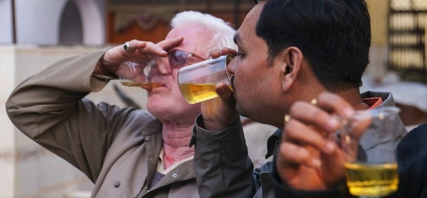Indian men drink, bathe in cow urine to fight diseases and stop spots