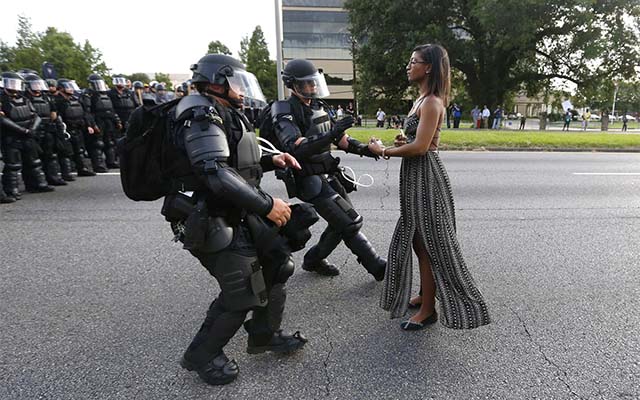 A demonstrator protesting the shooting death of Alton Sterling is detained by law enforcement near the headquarters of the Baton Rouge Police Department in Baton Rouge, Louisiana. - REUTERS/Jonathan