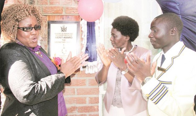 Secretary for Primary and Secondary Education Mrs Sylvia Utete-Masango (centre) is flanked by Domboramwari High School head Mrs Zondiwe Ncube (left) and headboy Simbarashe Kareza during the Secretary’s Merit Award ceremony held at the school in Epworth, outside Harare, yesterday. - Picture by Beauty Muchakazi